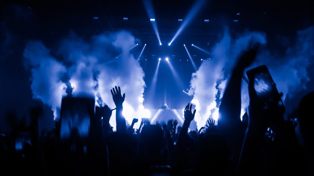 Happy people dancing at a nightclub party